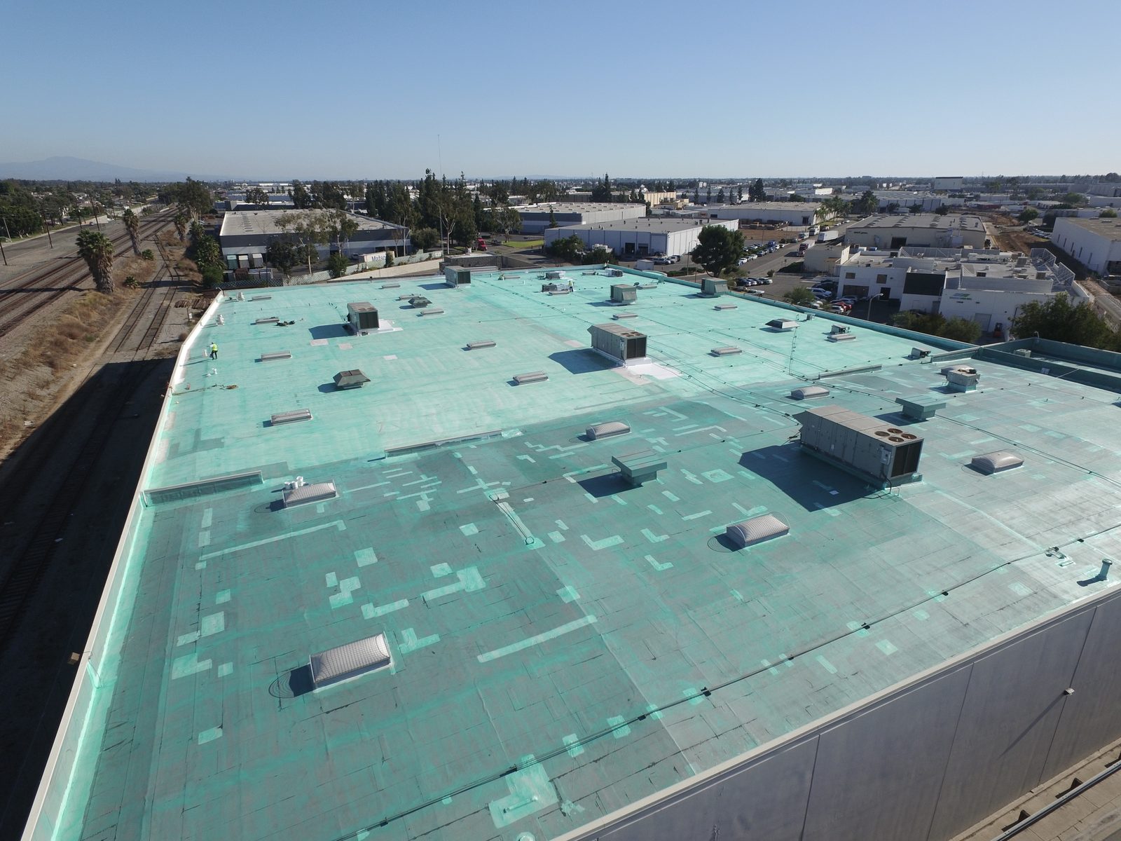 Aerial of a warehouse roof after a Polyglass silicone coating restoration