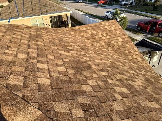 Warm tan architectural shingle roof seen from above