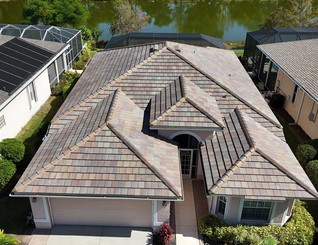 Drone view of a blend-color concrete tile roof on a single-story home