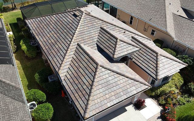 Aerial view of a multi-tone concrete tile hip roof