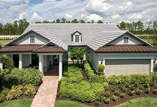 Single-story home with a light gray flat concrete tile roof and landscaped walkway