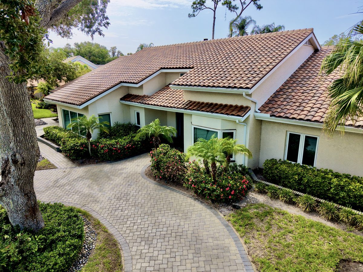 Aerial drone view of a new tile roof installed by Providential Roofing on a Florida home